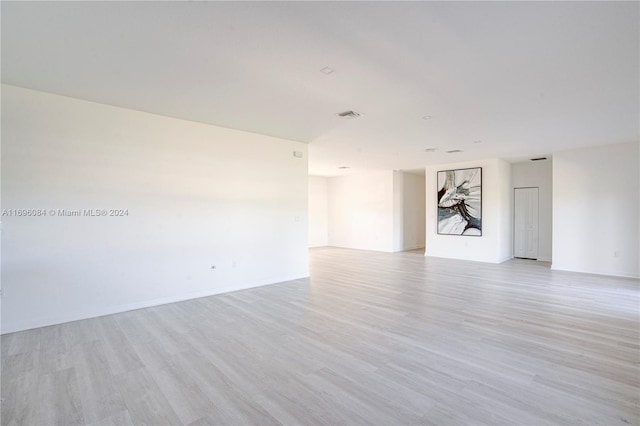 spare room with light hardwood / wood-style floors