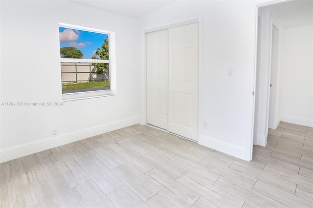 unfurnished bedroom featuring a closet