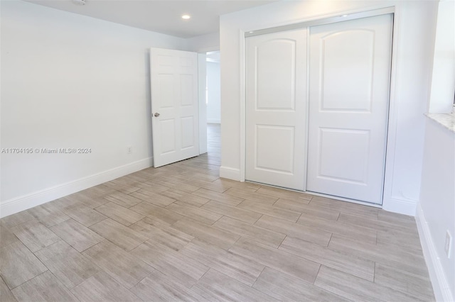 unfurnished bedroom featuring a closet