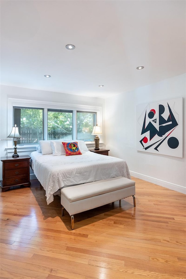 bedroom with light hardwood / wood-style flooring