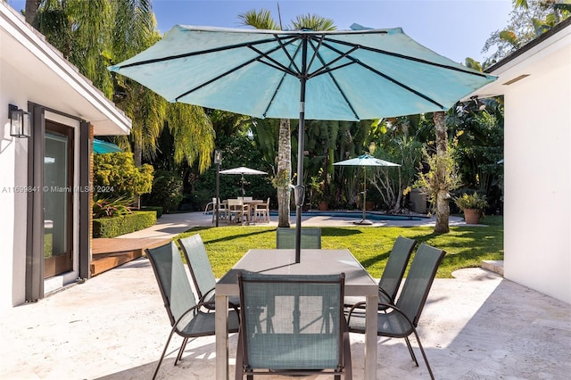 view of patio featuring a pool