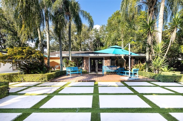 view of front of home with a wooden deck