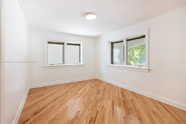 spare room with light hardwood / wood-style flooring