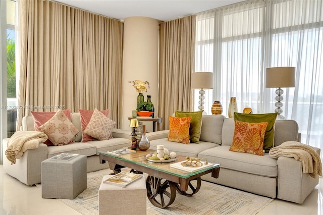 living room with light tile patterned flooring and a healthy amount of sunlight