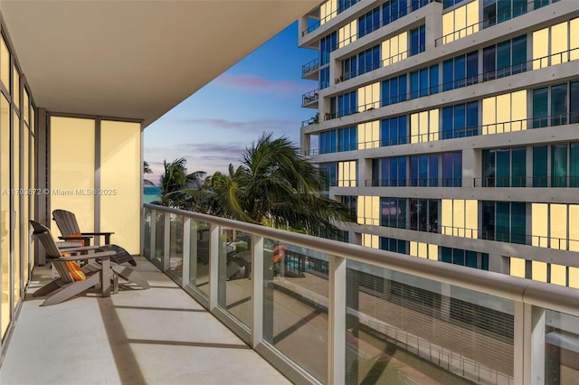 view of balcony at dusk