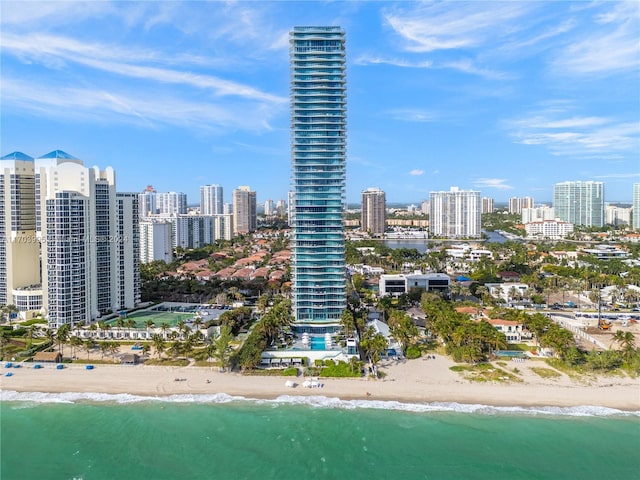 birds eye view of property featuring a view of the beach and a water view