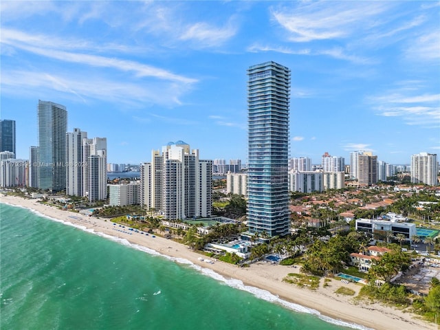 bird's eye view with a view of the beach and a water view