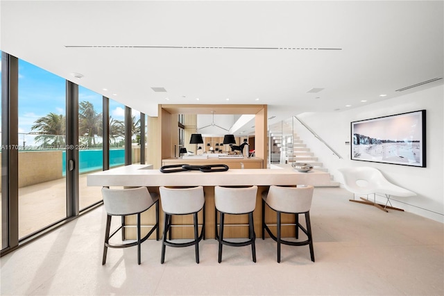 dining room featuring floor to ceiling windows