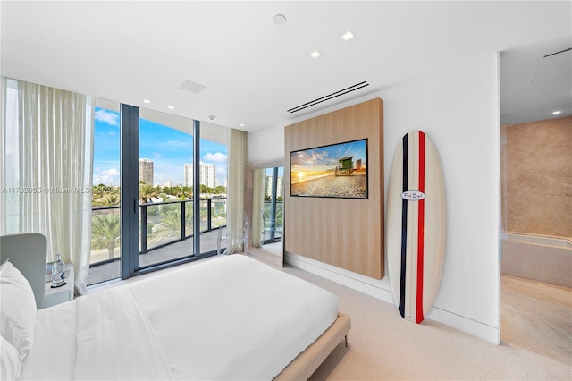 bedroom featuring light carpet and access to outside