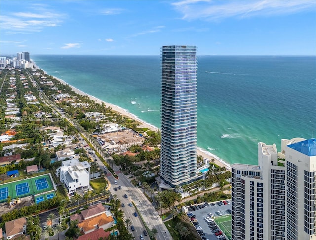 birds eye view of property with a view of the beach and a water view