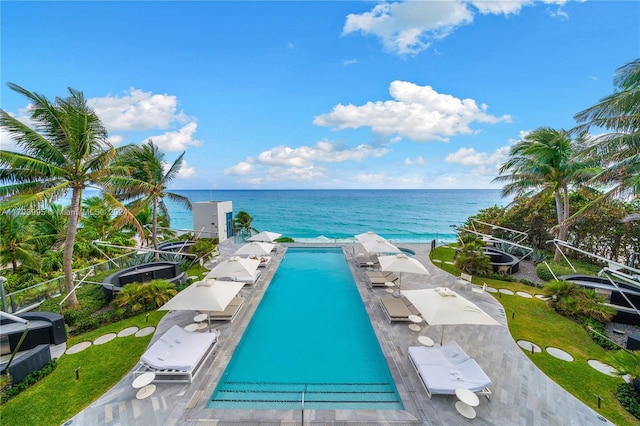 view of pool featuring a water view