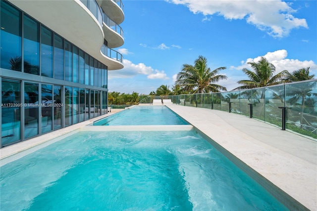 view of pool with a water slide