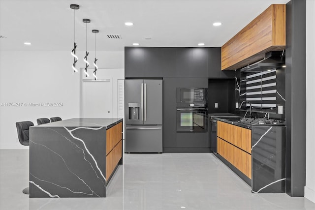 kitchen featuring sink, dark stone counters, pendant lighting, decorative backsplash, and black appliances