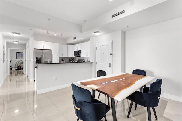 dining room with light tile patterned floors