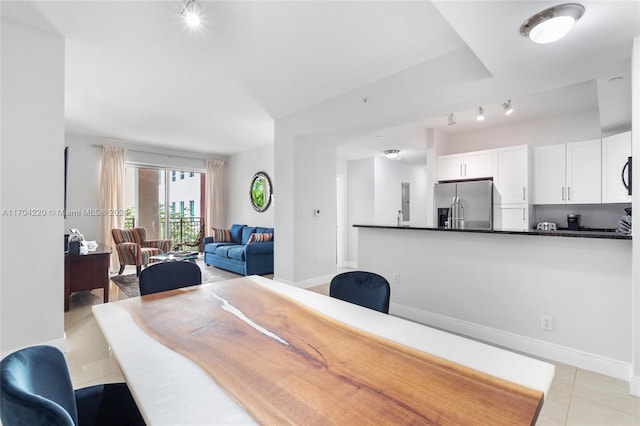 tiled dining room with track lighting