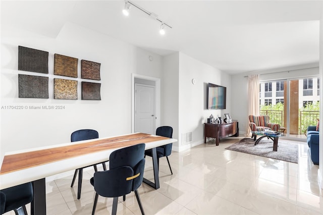 office area featuring light tile patterned floors and track lighting