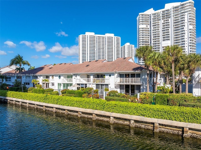 rear view of house featuring a water view