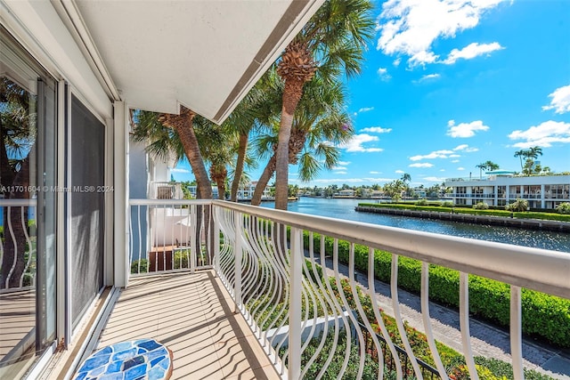 balcony featuring a water view