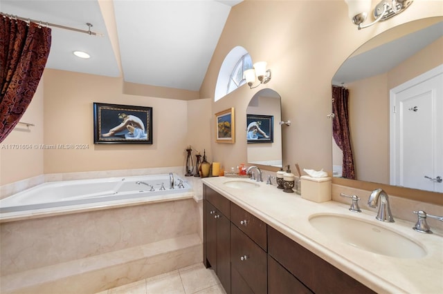 bathroom with vanity, tile patterned flooring, a relaxing tiled tub, and lofted ceiling