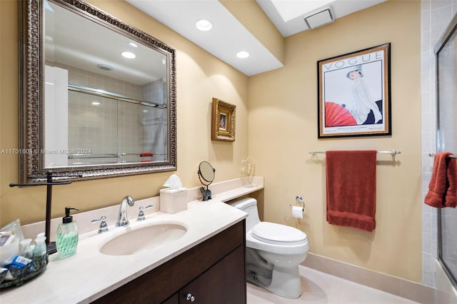 bathroom featuring tile patterned flooring, vanity, and toilet