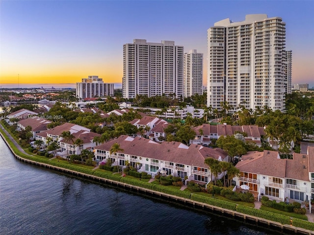 aerial view at dusk with a water view