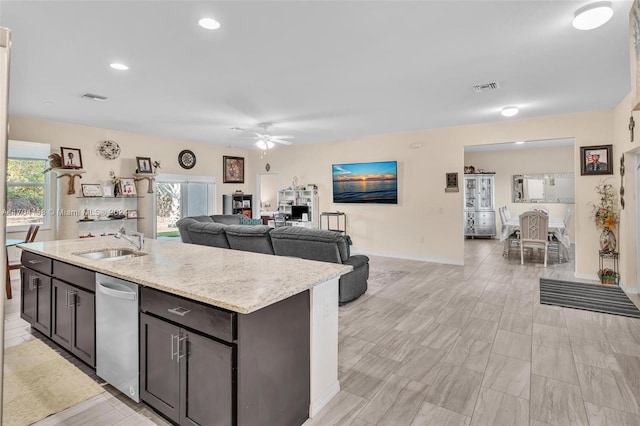 kitchen featuring ceiling fan, stainless steel dishwasher, plenty of natural light, and sink