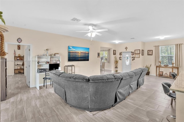 living room featuring ceiling fan