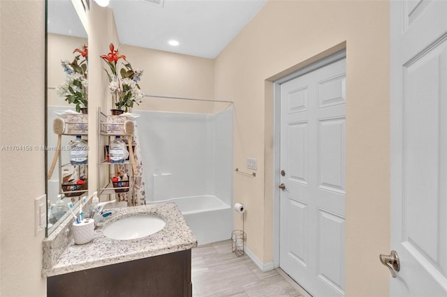 bathroom with vanity and shower / bathtub combination