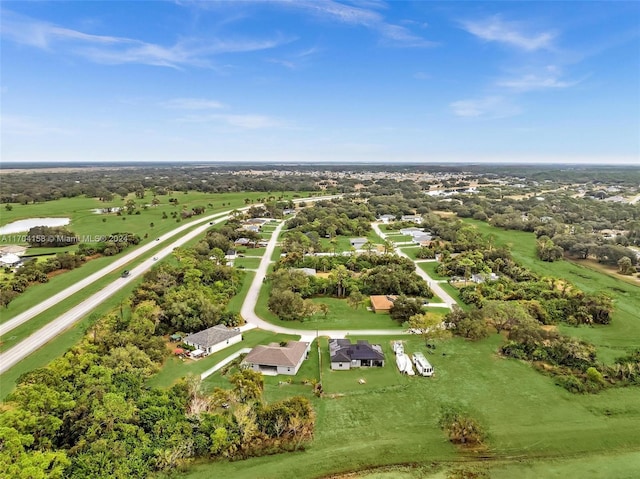 birds eye view of property with a rural view