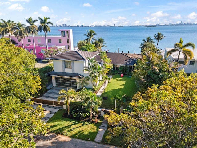 birds eye view of property featuring a water view