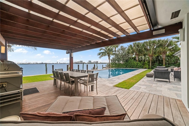 9301 N Bayshore Dr, Miami Shores, FL 33138 - wooden deck with an outdoor hangout area, a water view, an outdoor pool, and outdoor dining space