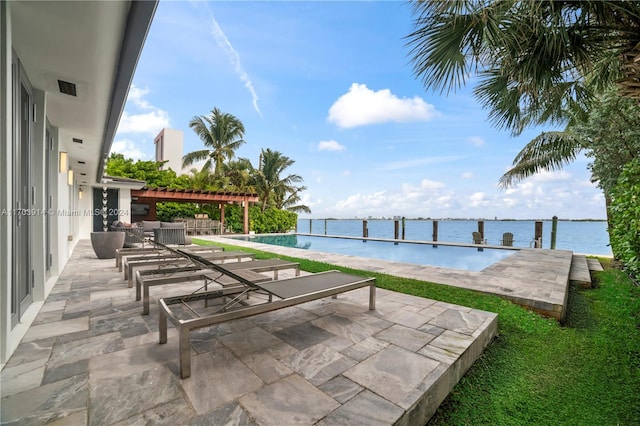 view of swimming pool featuring a patio area, a water view, and a pergola