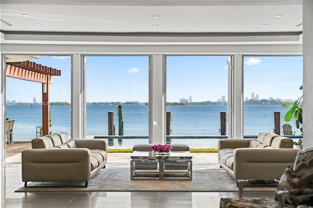 9301 N Bayshore Dr, Miami Shores, FL 33138 - living area featuring a water view and healthy amount of natural light