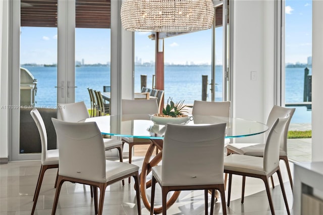 9301 N Bayshore Dr, Miami Shores, FL 33138 - dining room with a water view and french doors