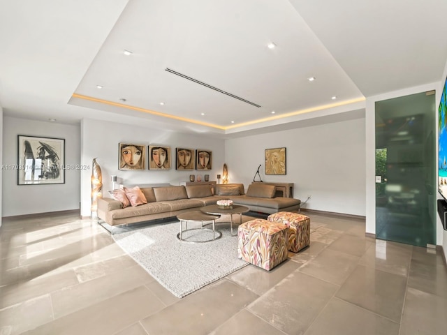 living room featuring a tray ceiling