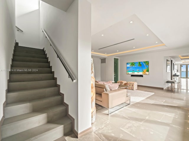 9301 N Bayshore Dr, Miami Shores, FL 33138 - staircase featuring recessed lighting and a tray ceiling