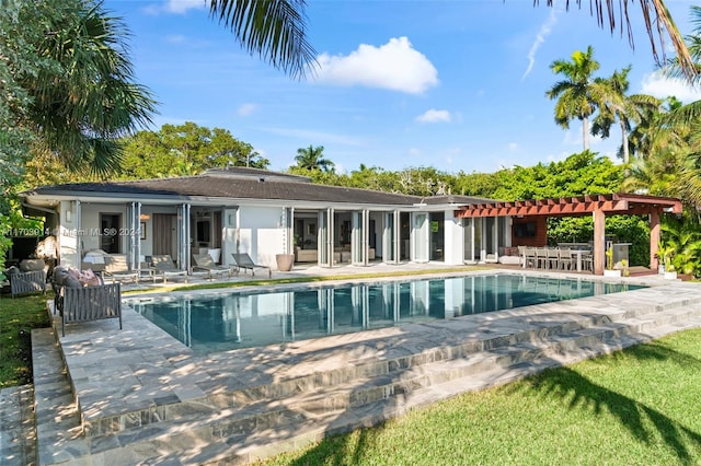 9301 N Bayshore Dr, Miami Shores, FL 33138 - swimming pool featuring a pergola and a patio area