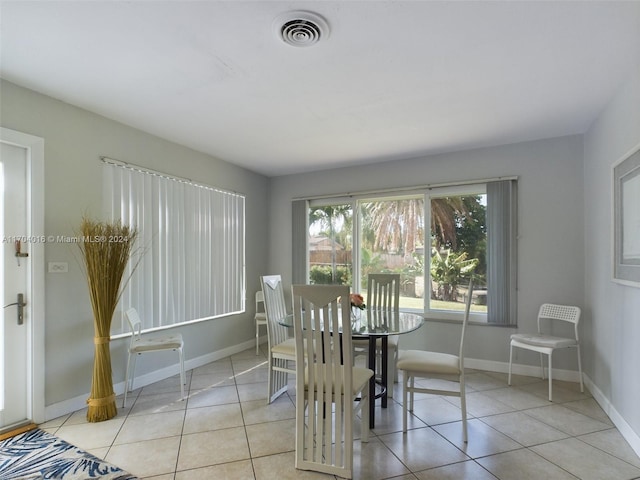 dining space with light tile patterned floors