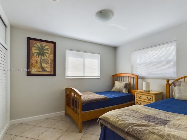 bedroom with light tile patterned flooring