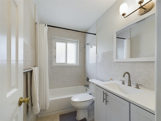 full bathroom featuring vanity, shower / bath combination with curtain, tile patterned flooring, toilet, and tile walls