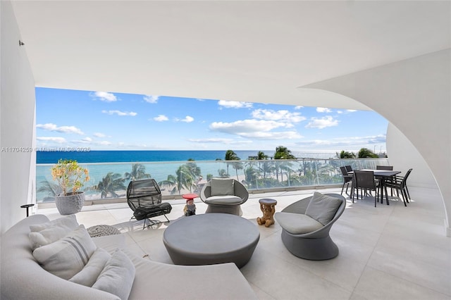 view of patio featuring an outdoor hangout area, outdoor dining space, and a water view