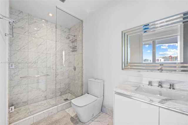 bathroom featuring vanity, toilet, and a shower with door