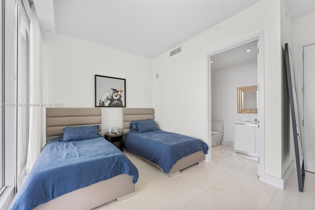 bedroom with visible vents, marble finish floor, connected bathroom, and baseboards