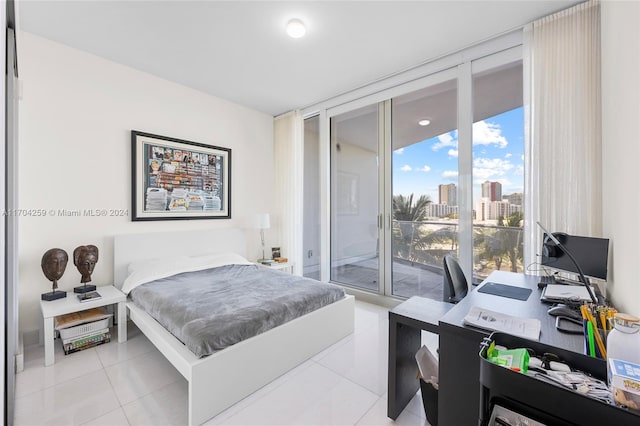 tiled bedroom with access to exterior and floor to ceiling windows