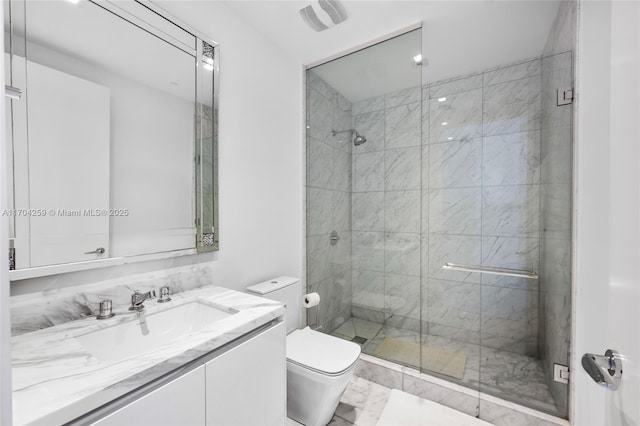 full bathroom with vanity, toilet, marble finish floor, and a stall shower