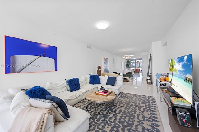 living area featuring visible vents and tile patterned floors