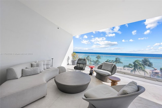 balcony with a water view and an outdoor hangout area