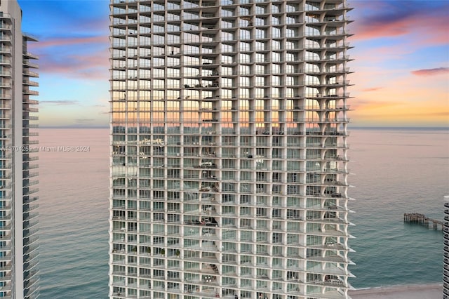 outdoor building at dusk featuring a water view