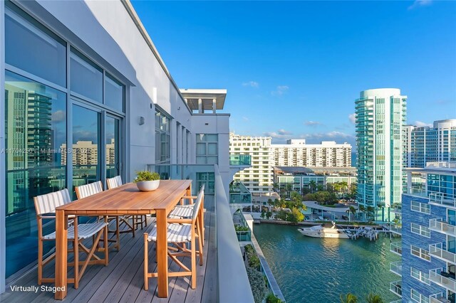 balcony featuring a water view