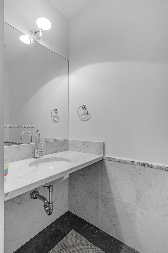 bathroom with tile patterned flooring and sink